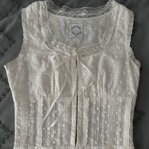 With Jèan white dress adjustable in the back. Worn once